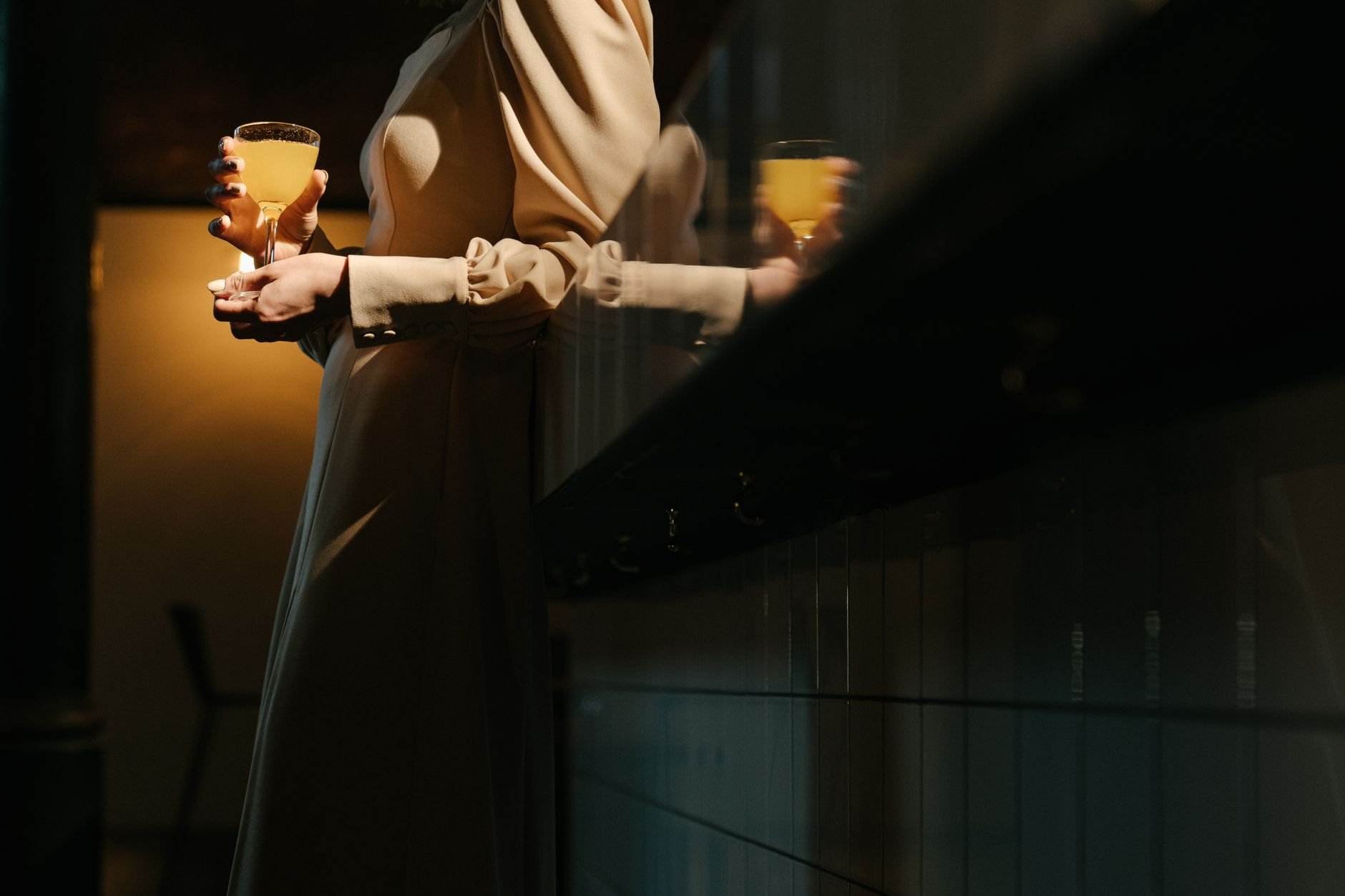 Sophisticated cocktail bar atmosphere with dim candlelight