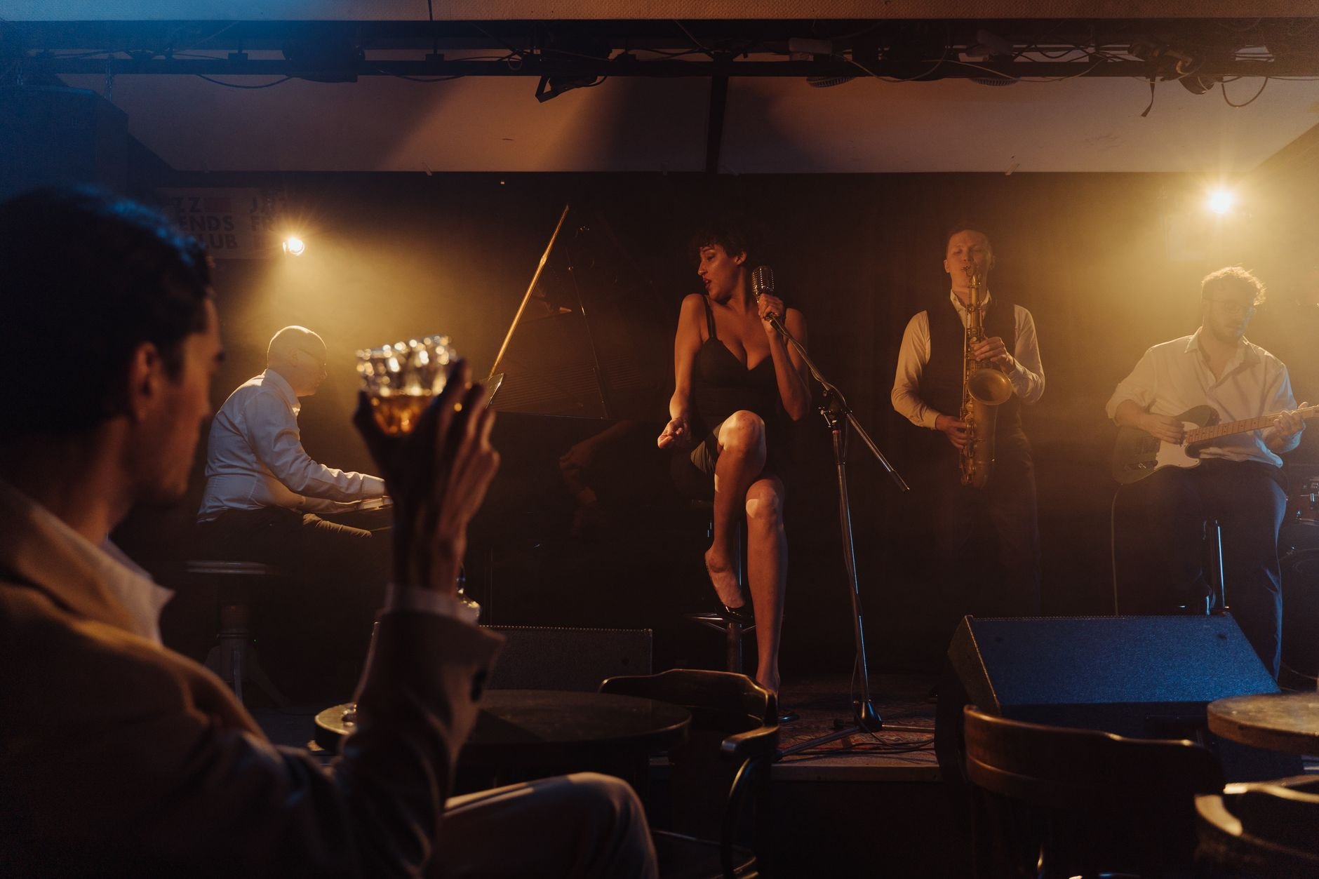 Jazz band performing live in intimate venue atmosphere